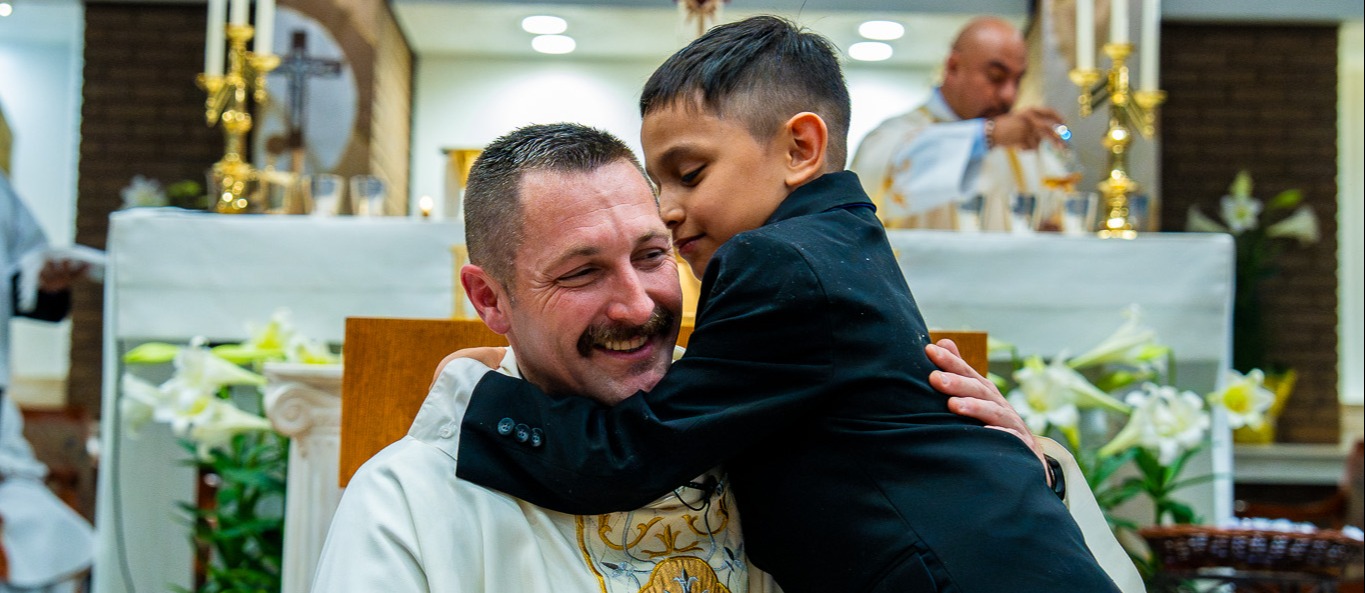 student with priest 