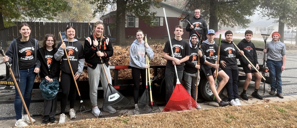 students with rake 