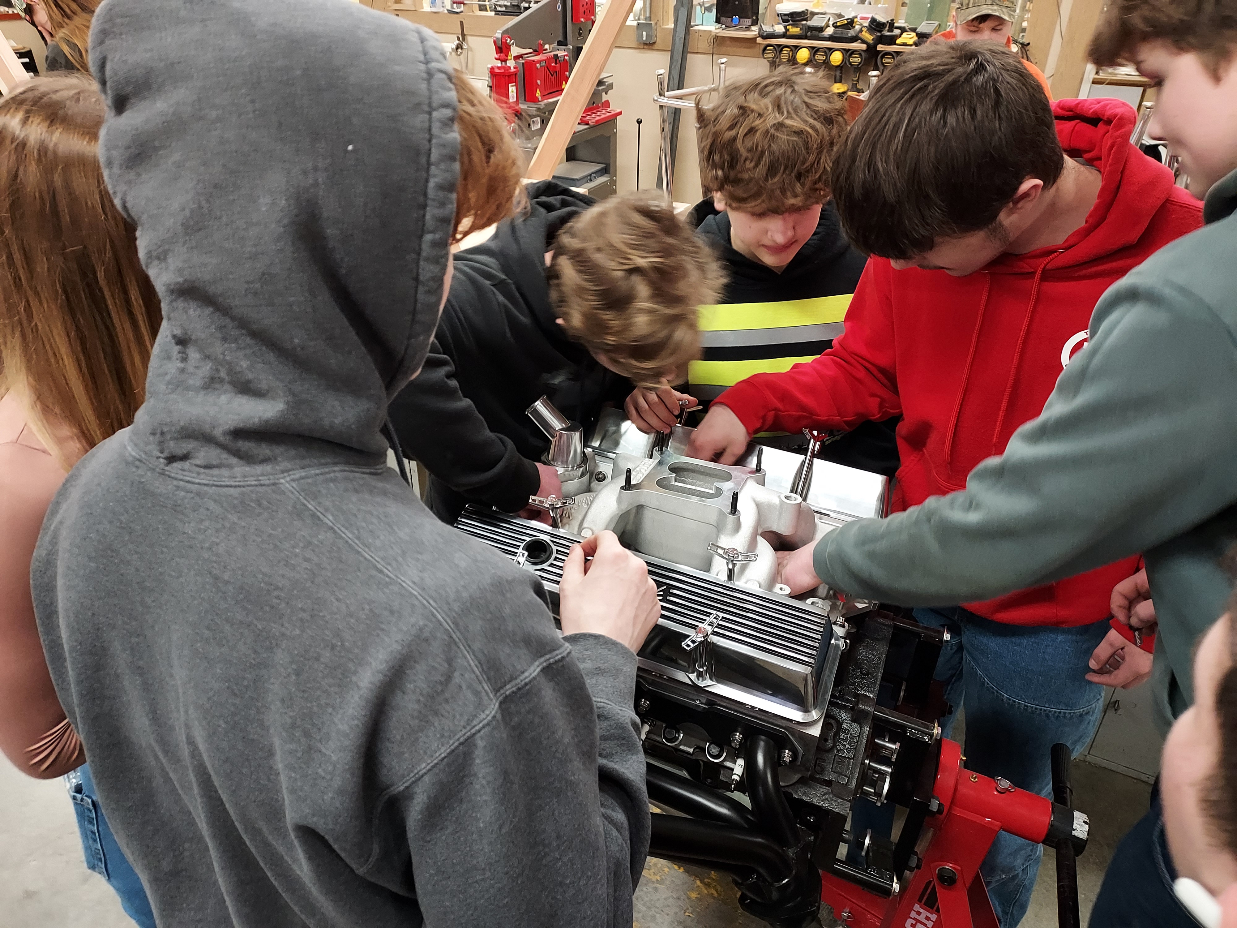 Students working on engine.