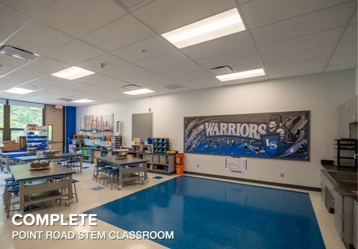 Overview of the STEM Room featuring the lego wall and desks