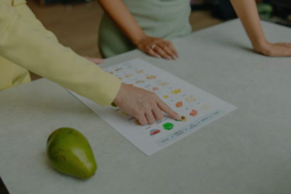 person pointing to worksheet