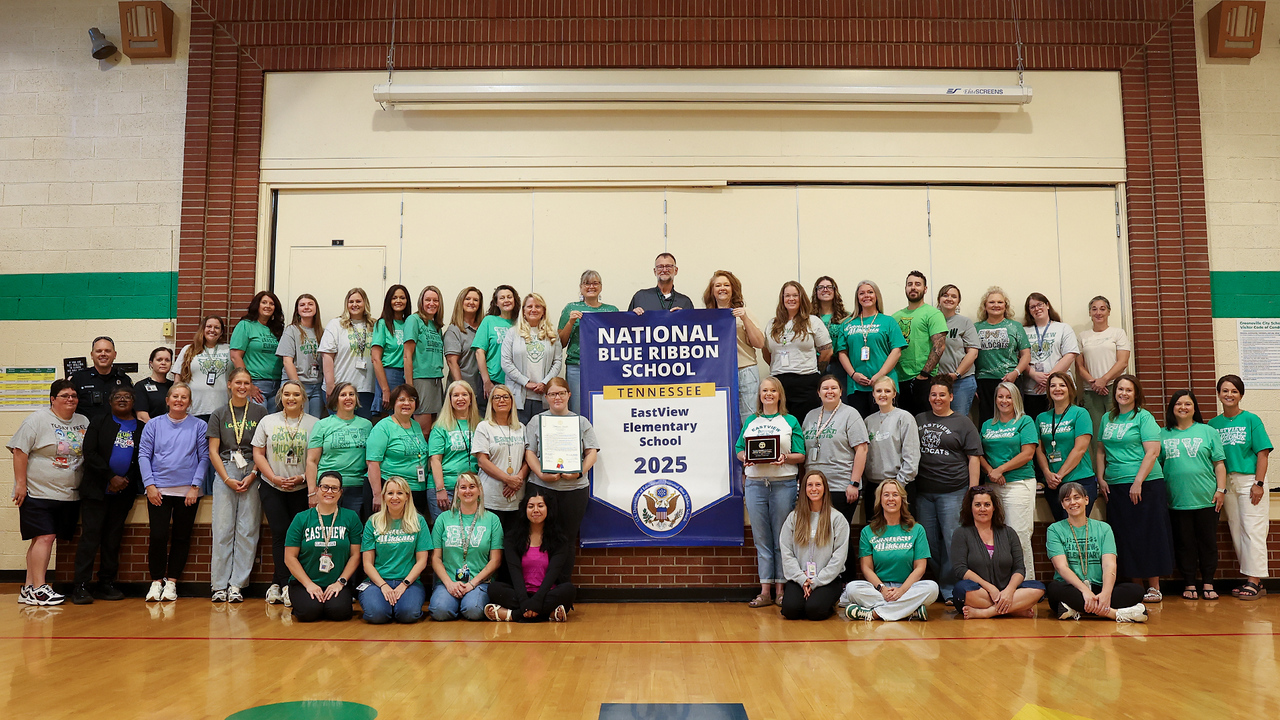 staff with blue ribbon