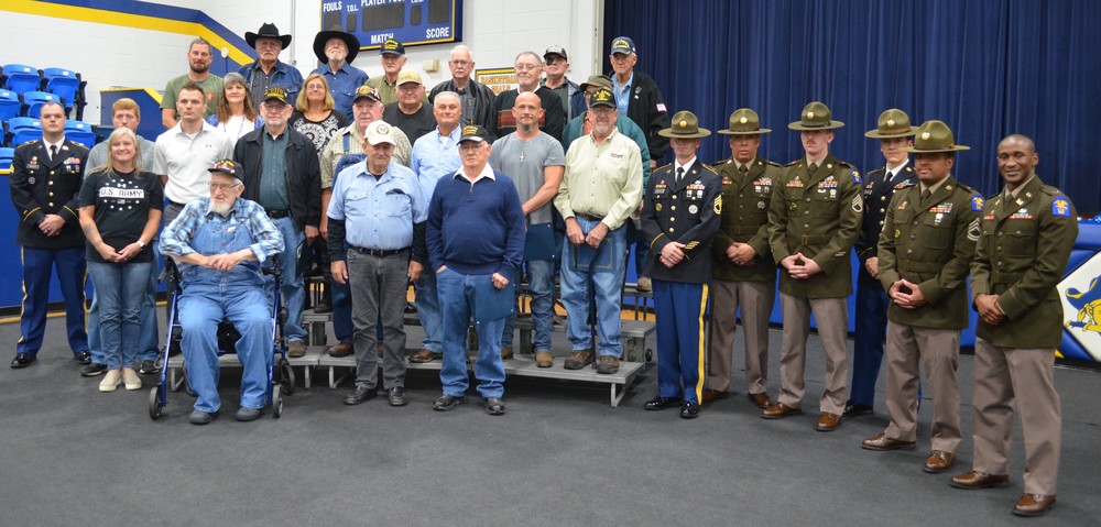 34 local heroes pose for a photo after the Veterans Day Ceremony