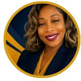 Woman in business attire with curly hair and makeup smiles at the camera in front of a blue and yellow background.
