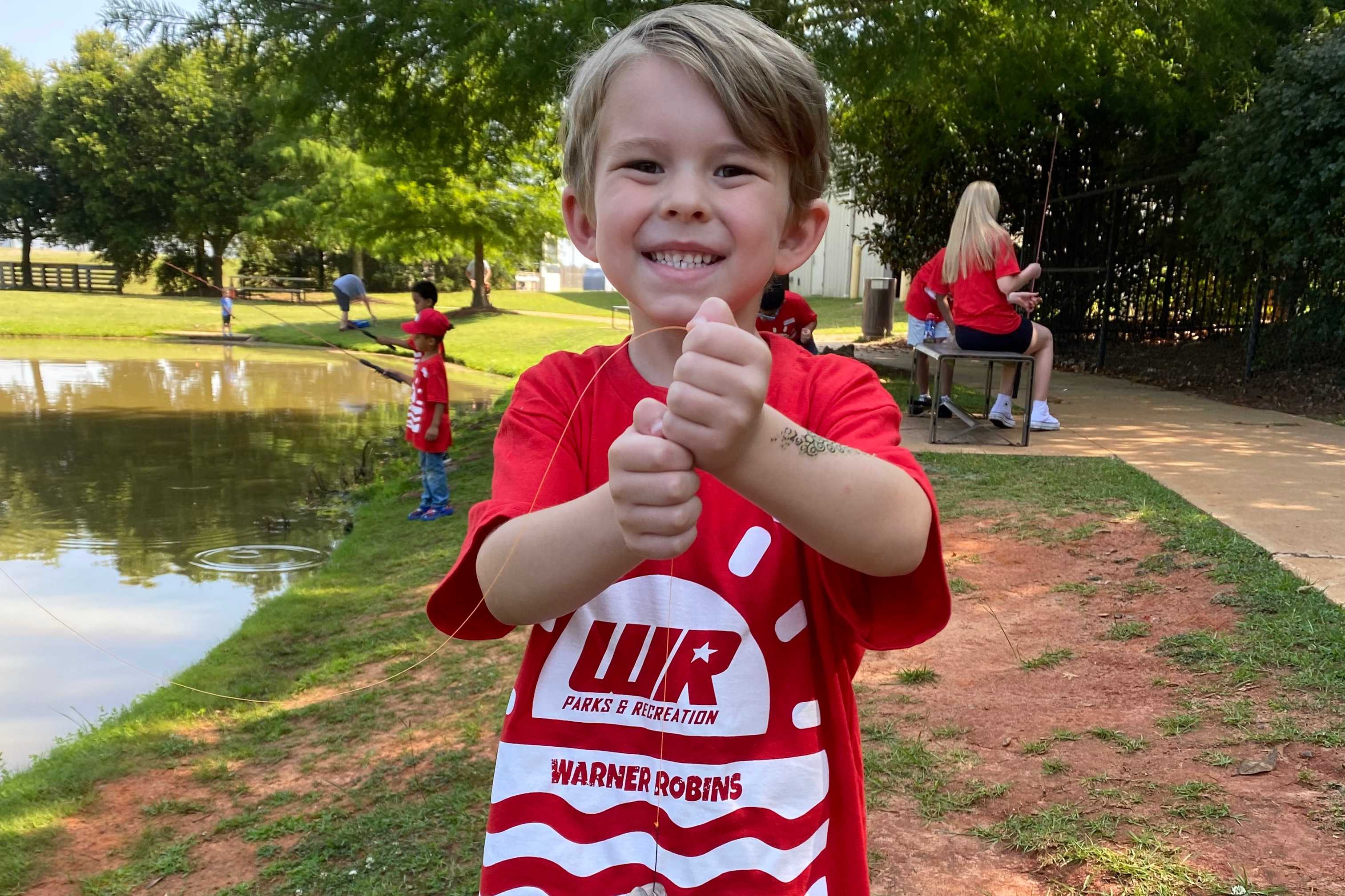 camper fishing on field trip