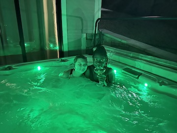 two teens in a hot tub