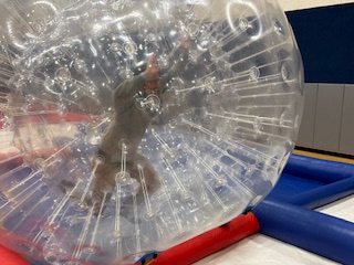 player inside a bubble ball rolling