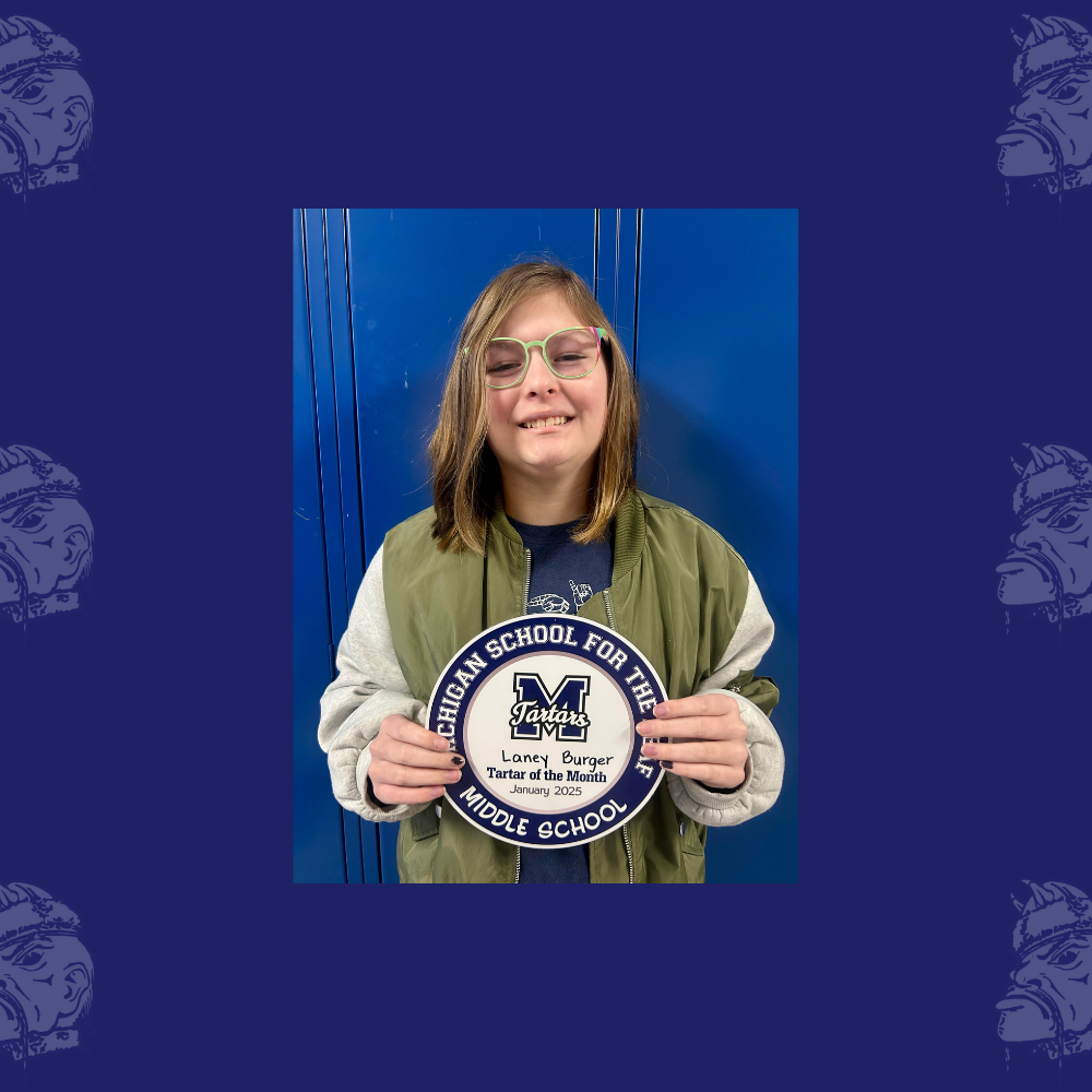 Laney Burger Holding Middle School Student of Month Plaque for January 2025