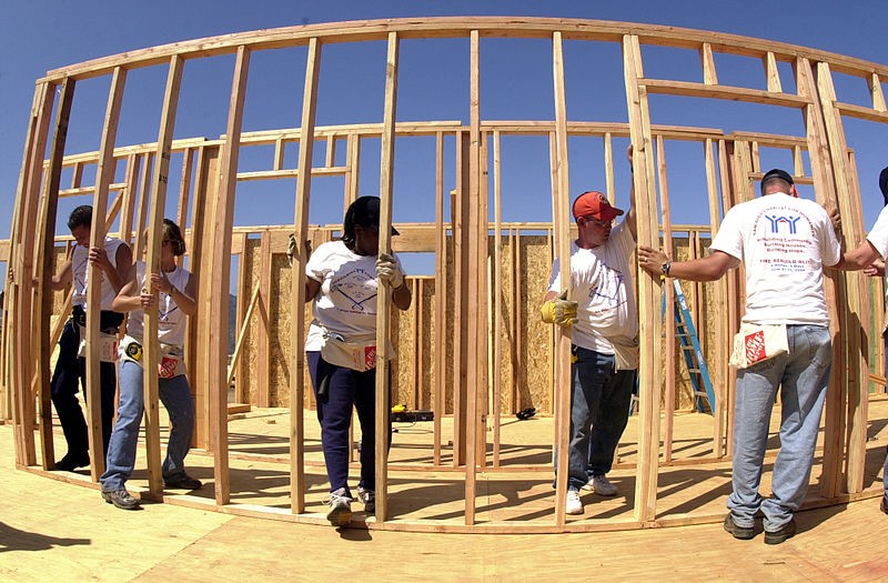 people working on a house