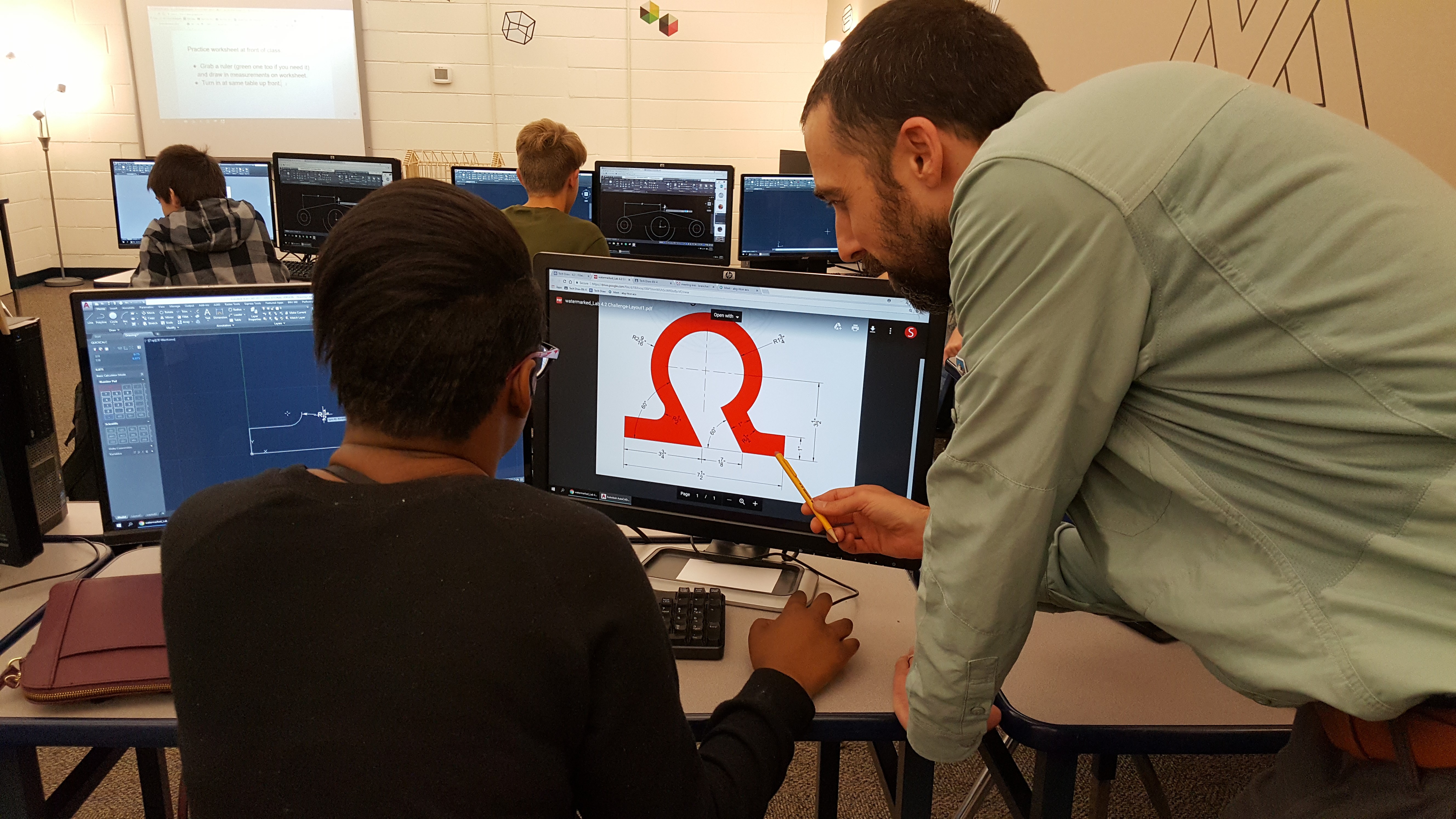 teacher helping student in class