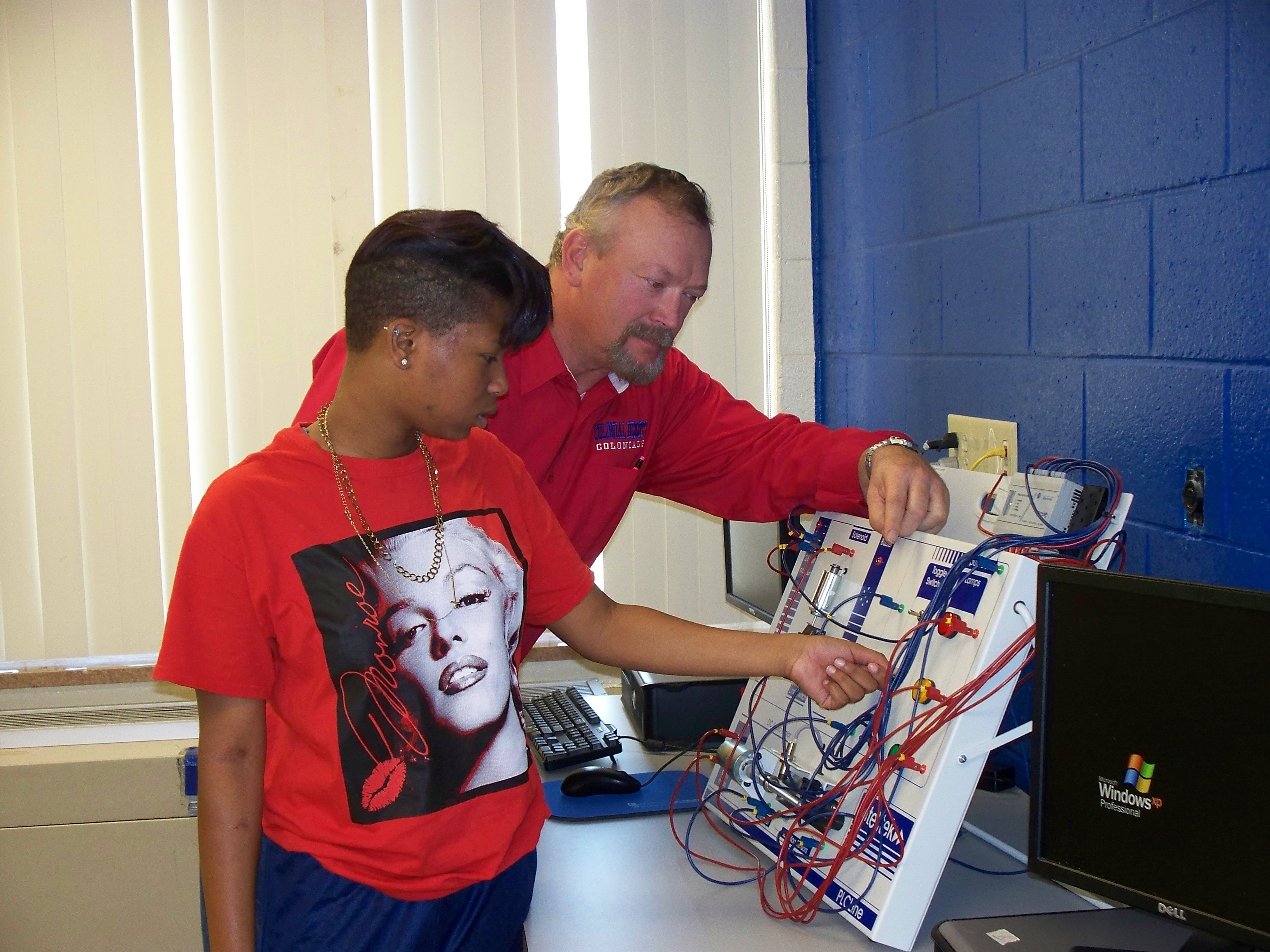 teacher helping student
