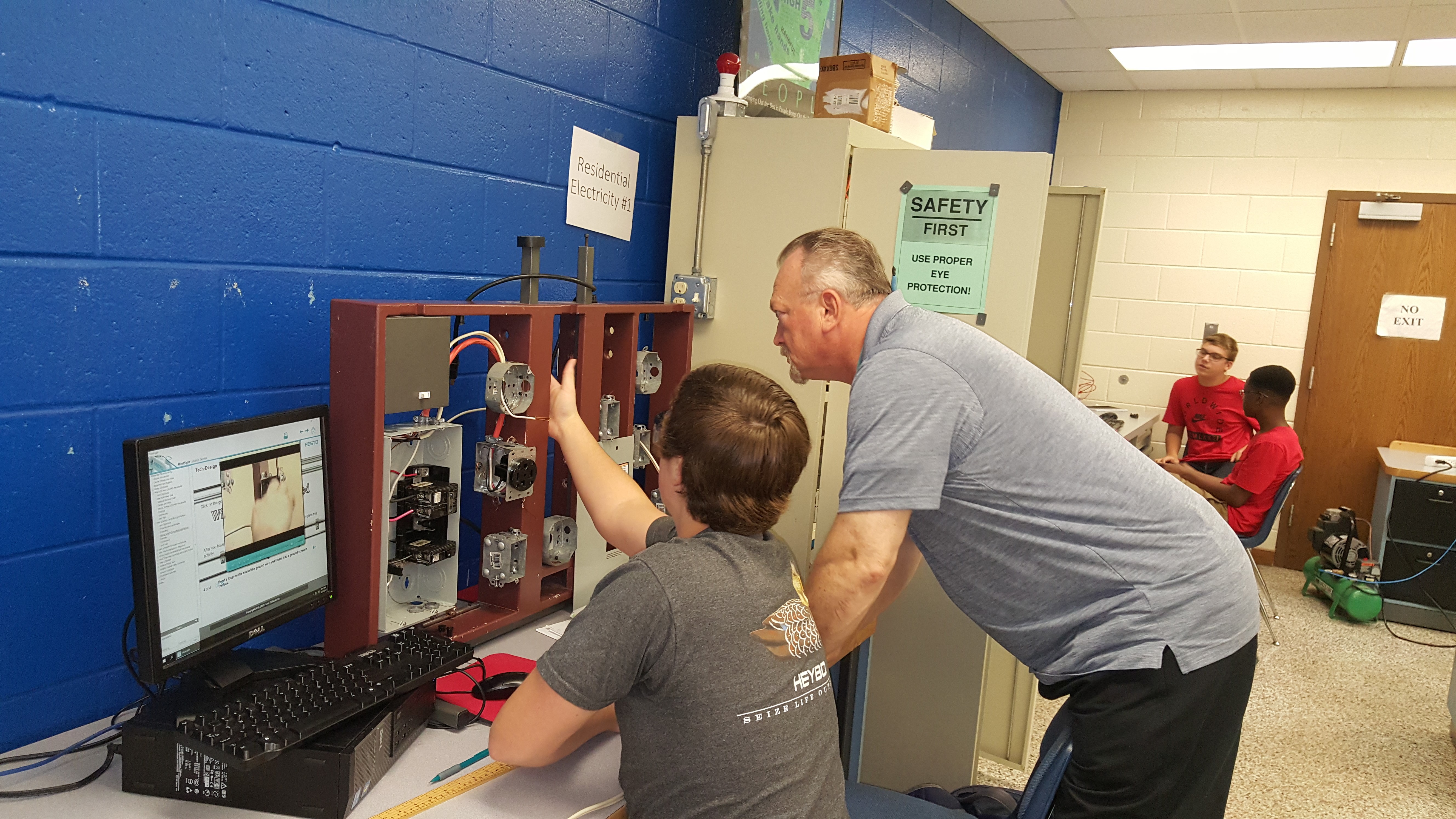 teacher helping student