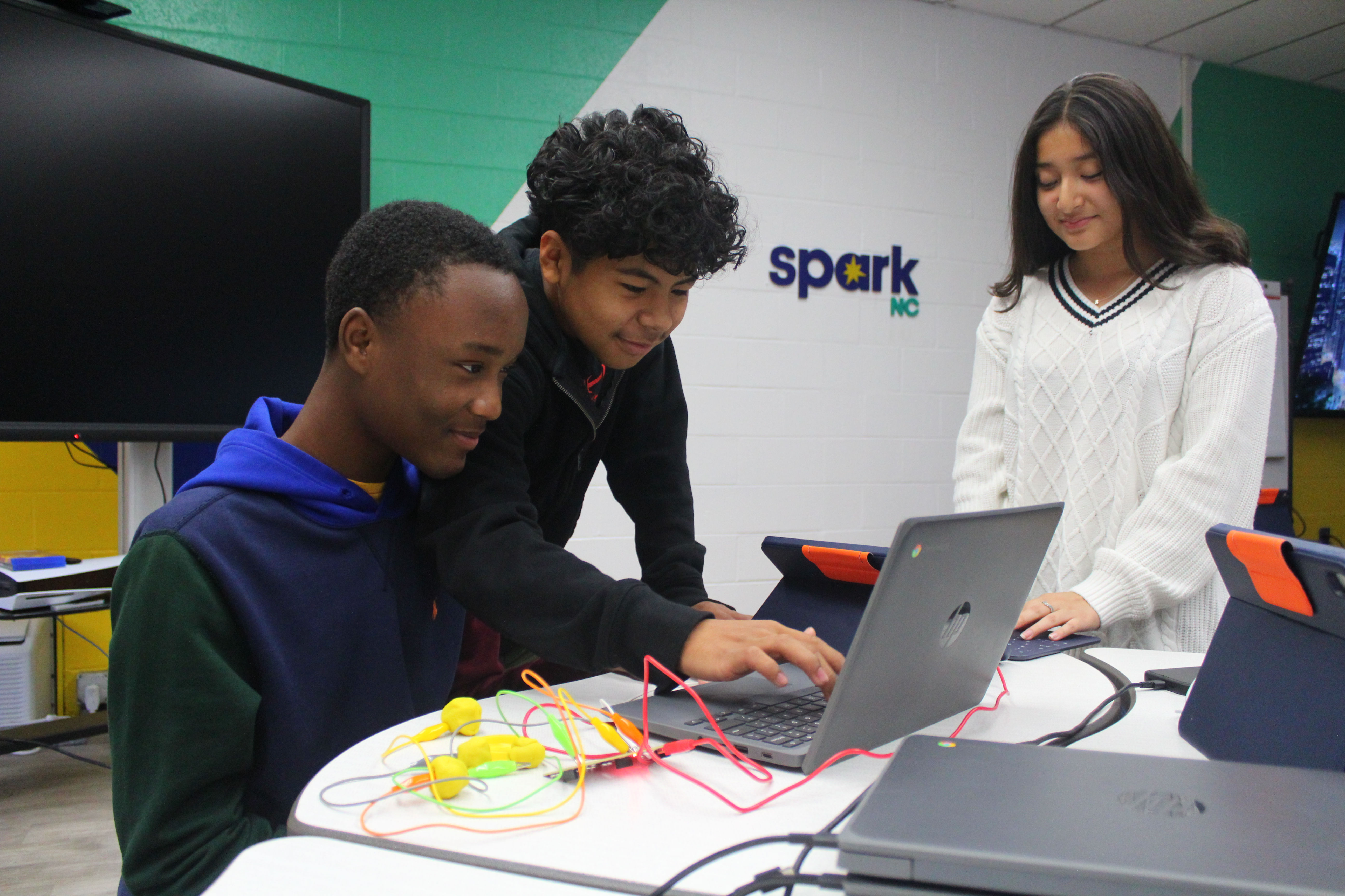 Students collaborating on the Makey Makey circuitry unit!