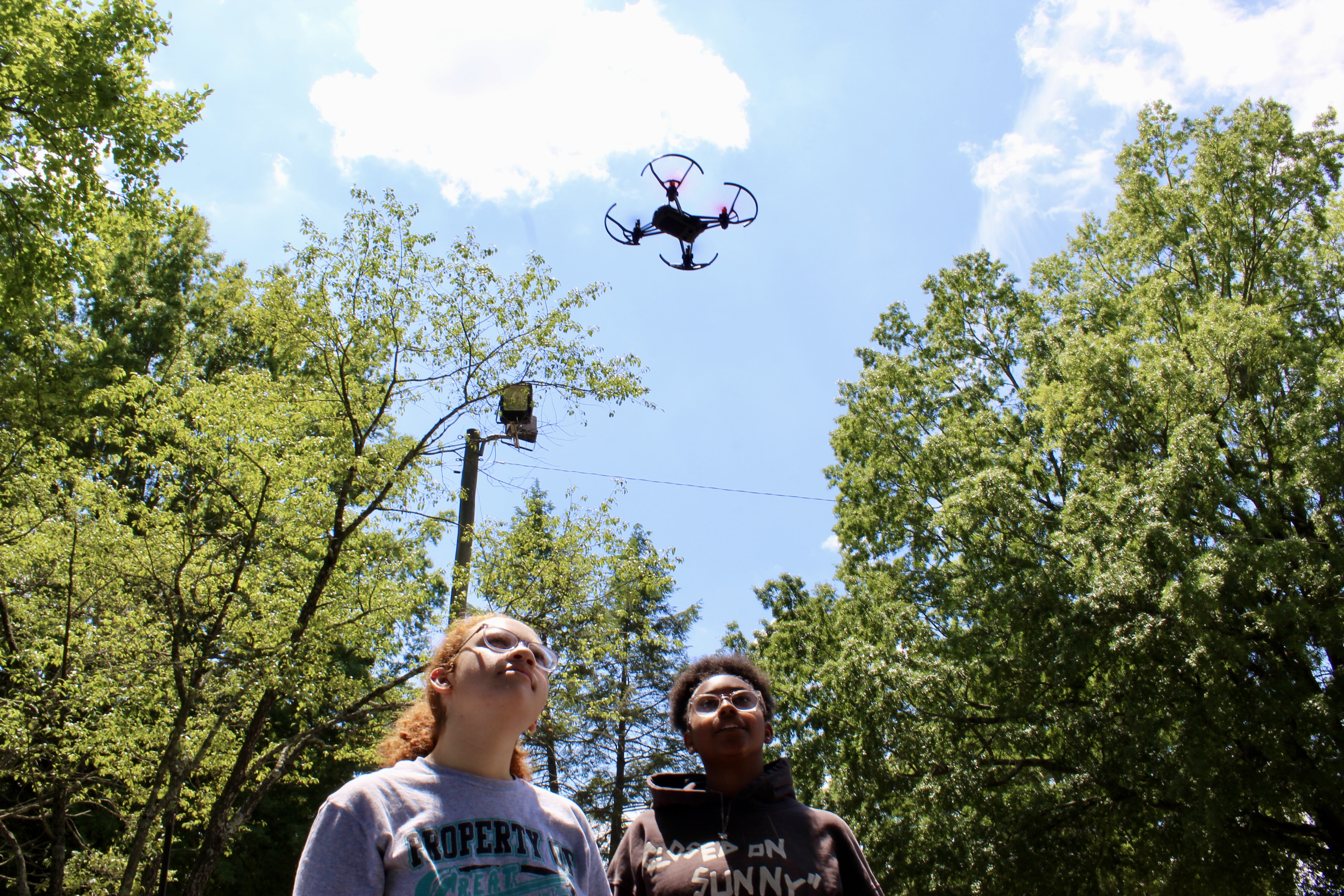 Students Ariana Turner and Alisa Williams fly a drone outside of the Sparklab!