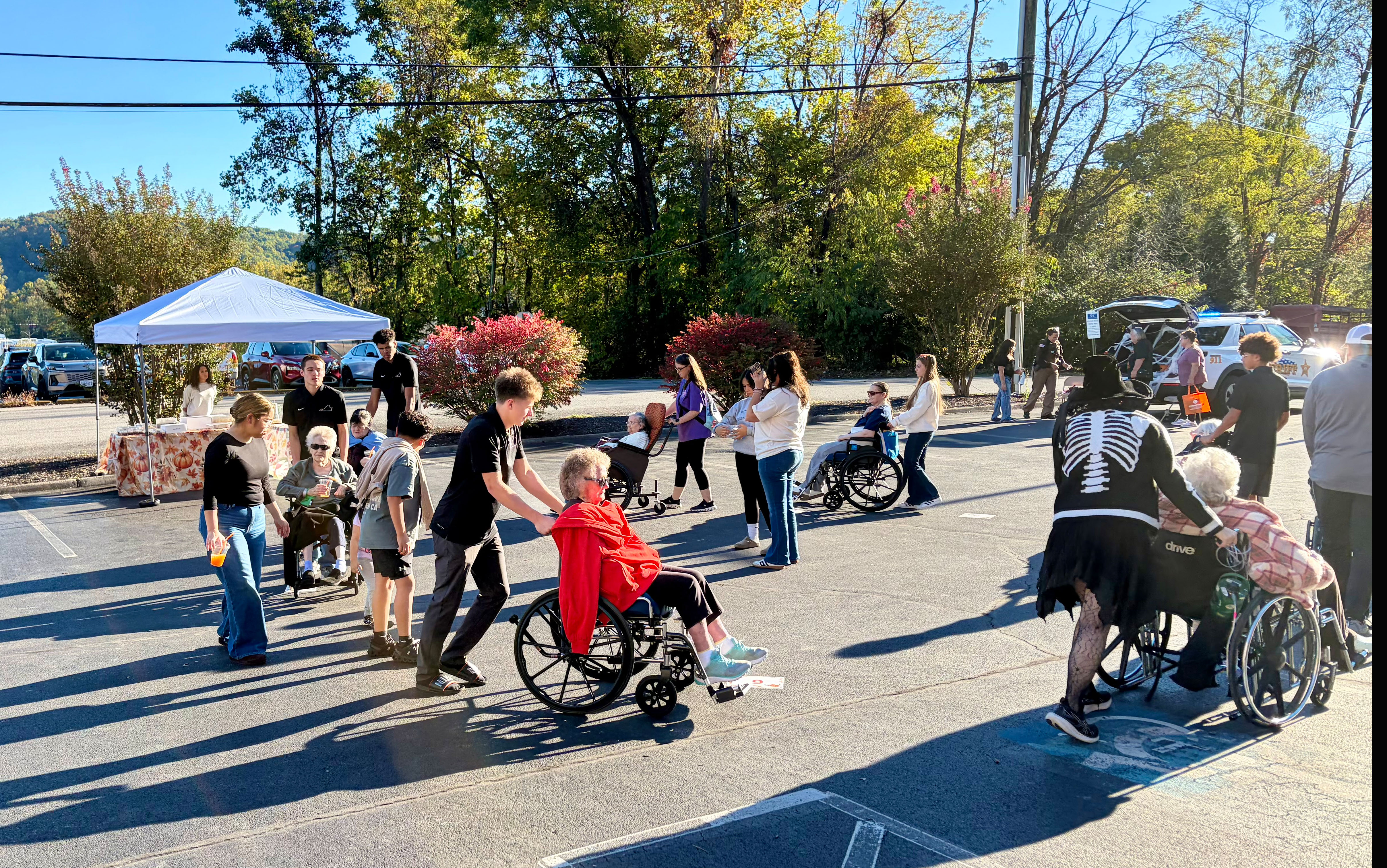 VHS Basketball team members visited patients at NHC and took them outside to enjoy the beautiful fall weather.