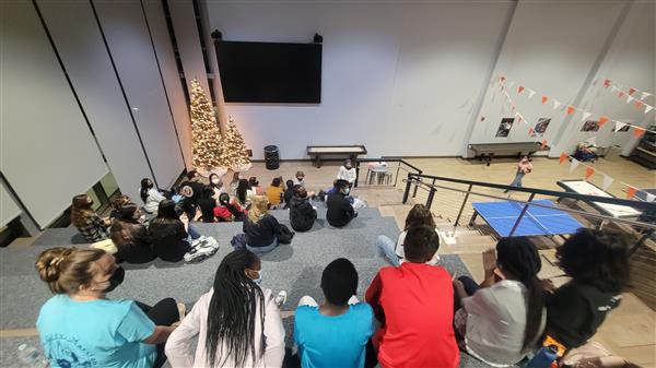 people sitting and talking to each other doing an activity