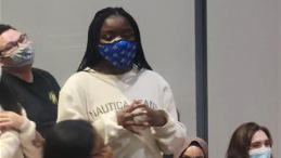 girl talking while wearing a facemask