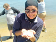 girl holding an object with her hands