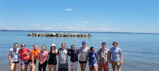 people standing at the lake