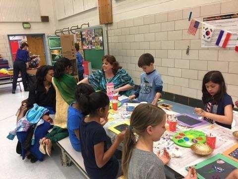 A group of children engaged in a creative activity at an after-school program.