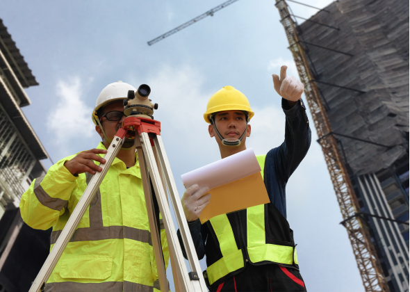 Construction workers planning site