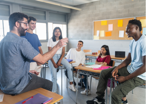 Students learning from teacher in classroom