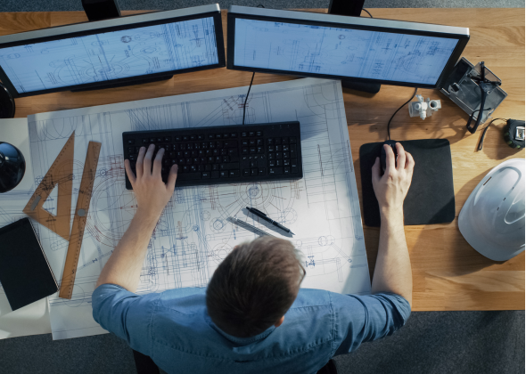 Man working with double monitors