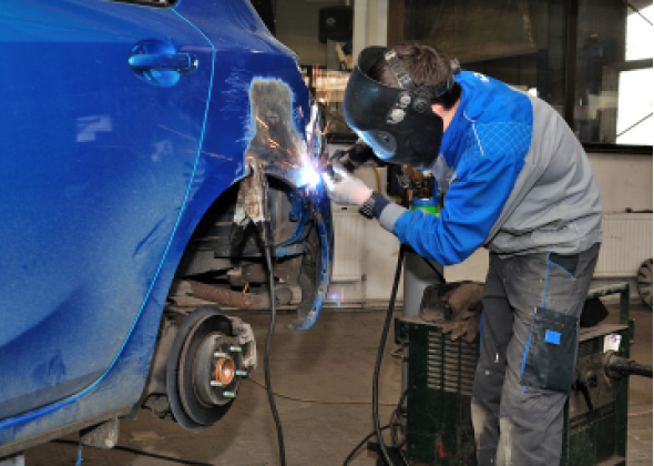 Student working on car