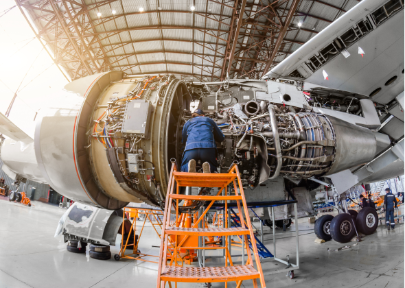 Person working on jet engine