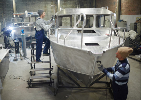 2 people working on boat