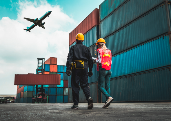 2 people walking on cargo area