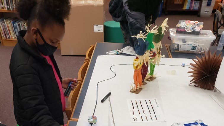 Girl working on a fall project at classroom