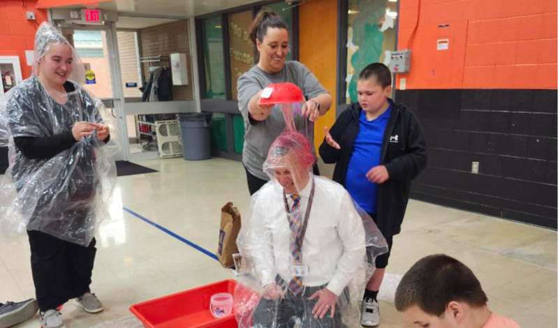 students sliming superintendent