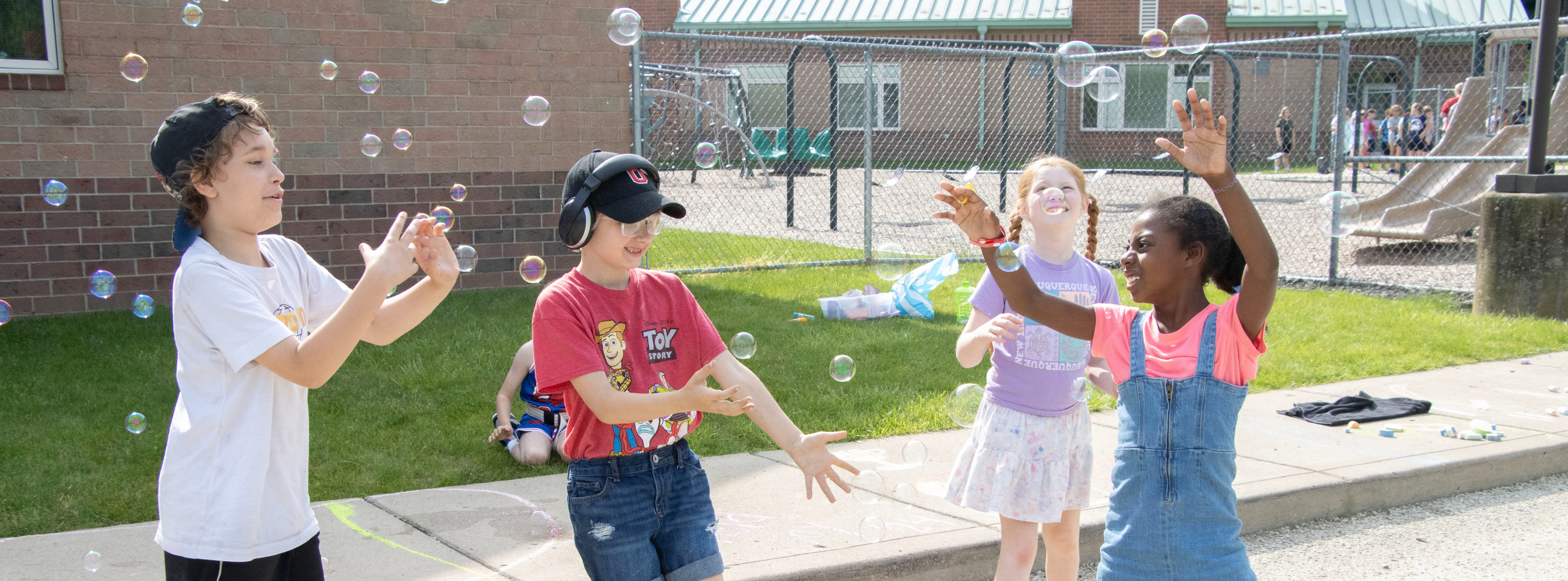 student playing with bubbles
