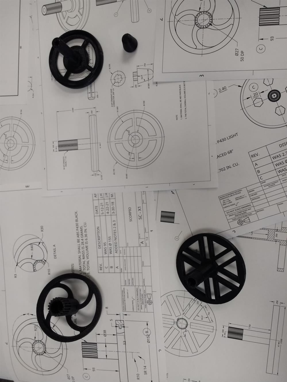A collection of engineering diagrams, gears, and mechanical components.
