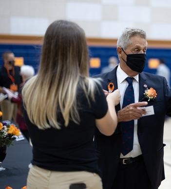 female student getting awarded the  hall of fame