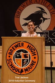 teal jackson receiving hof award at ceremony