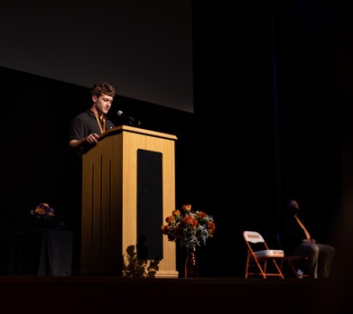 student speaking at the podium