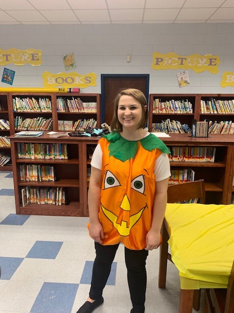 smiling in pumpkin costume