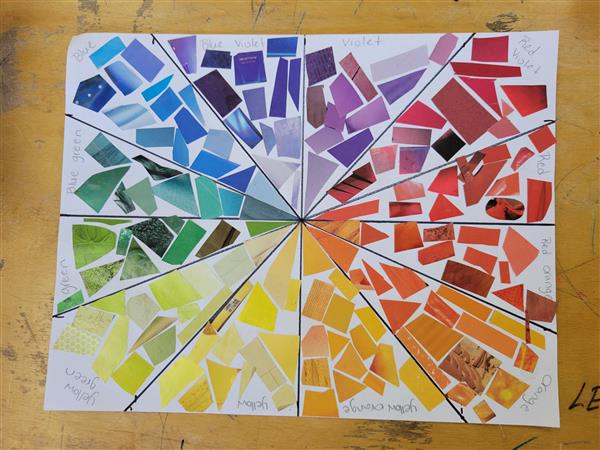 A colorful and vibrant mosaic art piece on a table.