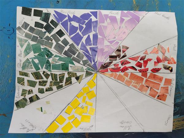 A colorful and vibrant mosaic art piece on a table.