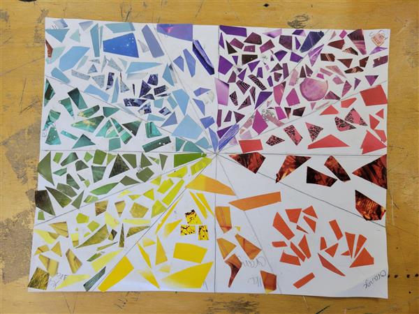 A colorful and vibrant mosaic art piece on a table.