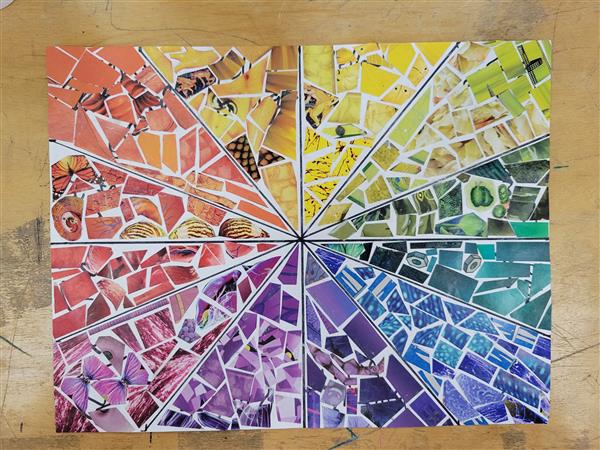 A colorful and vibrant mosaic art piece on a table.
