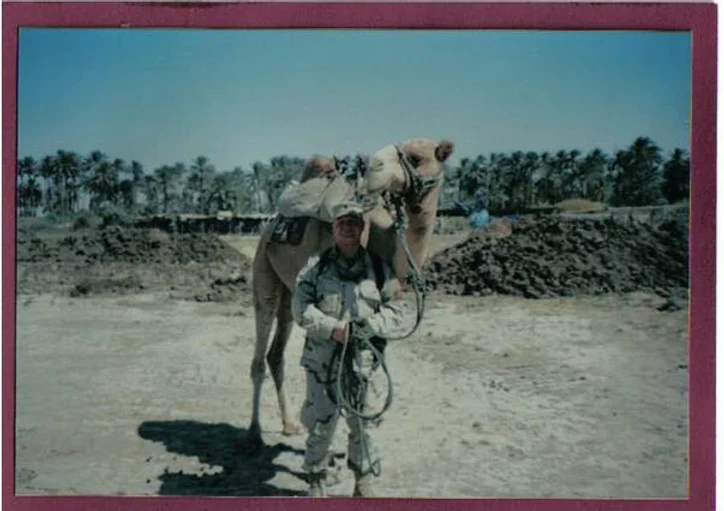 Mr. Dougan in front of camel