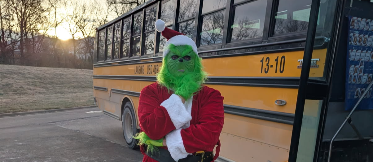 Grinch in front of school bus