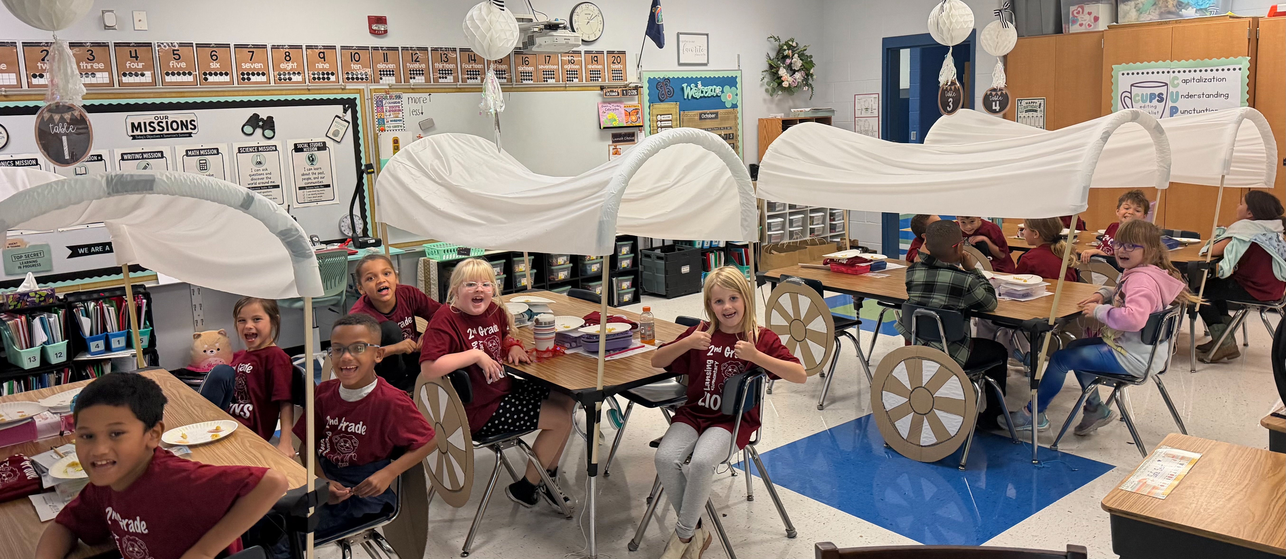 2nd Grade Students with their own pioneer time covered wagons