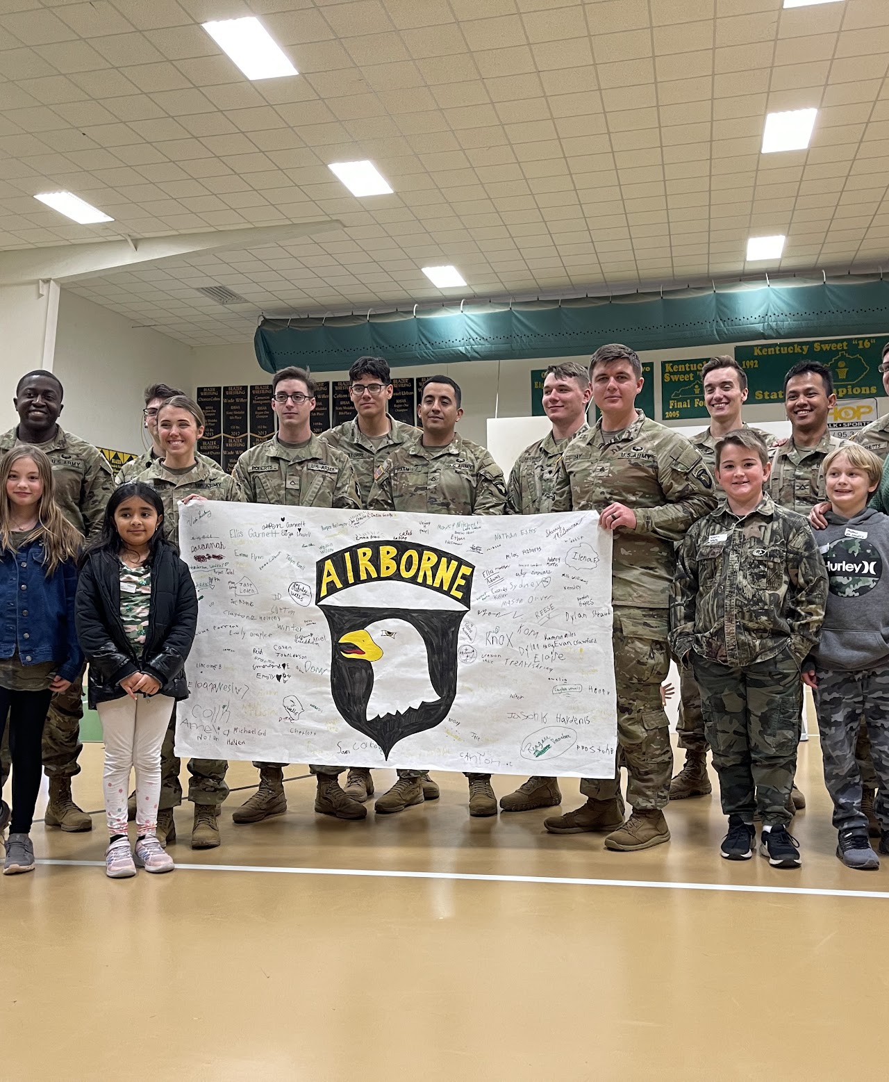 military personnel and kids at school