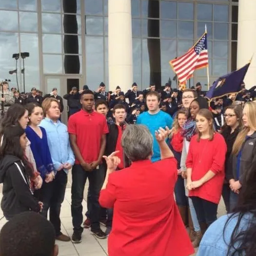 Members of the Upper School Choir sing the National Anthem for the  Hopkinsville, Kentucky Veteran’s Day Parade