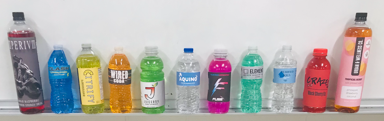 variety of bottled drinks aesthetically placed together image