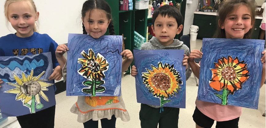 little students showing their flower painted art projects